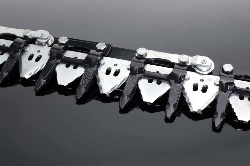 Close-up of EasyCut II knife system with sectional sickle blades for combines
